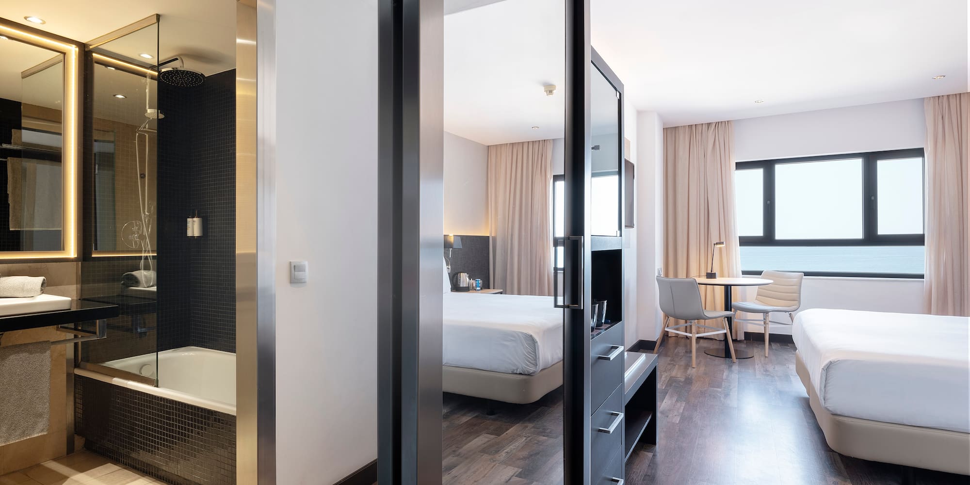 a room with two beds and a shower