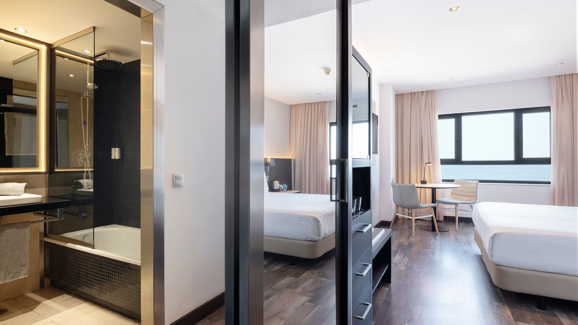 a room with two beds and a shower