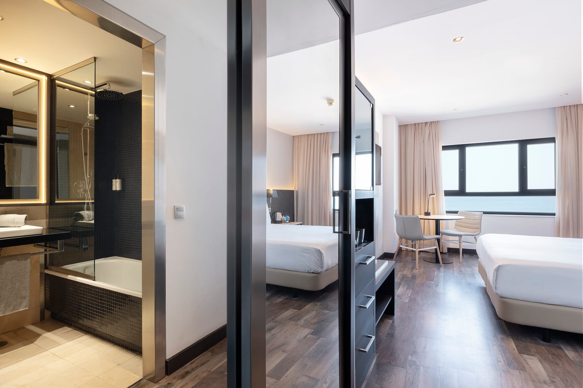 a room with two beds and a shower