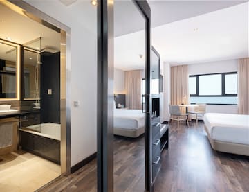 a room with two beds and a shower
