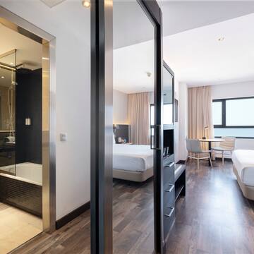 a room with two beds and a shower
