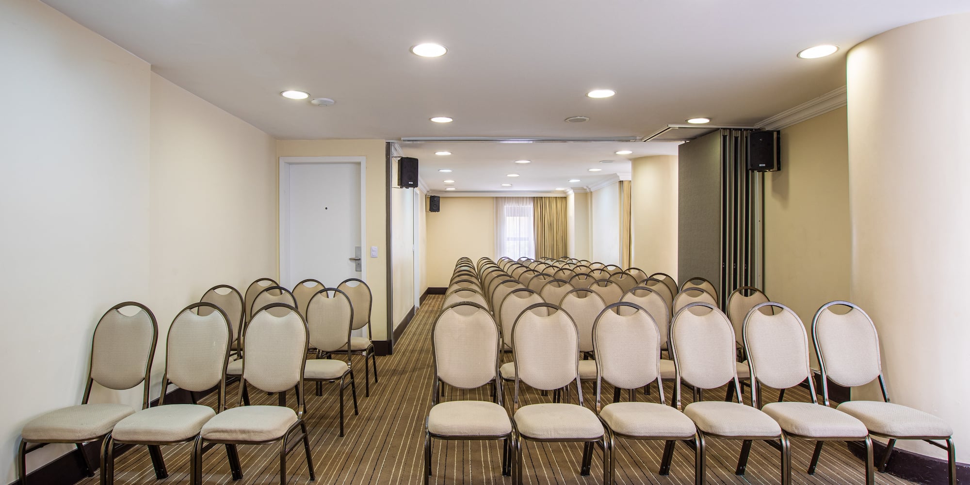 a room with rows of chairs