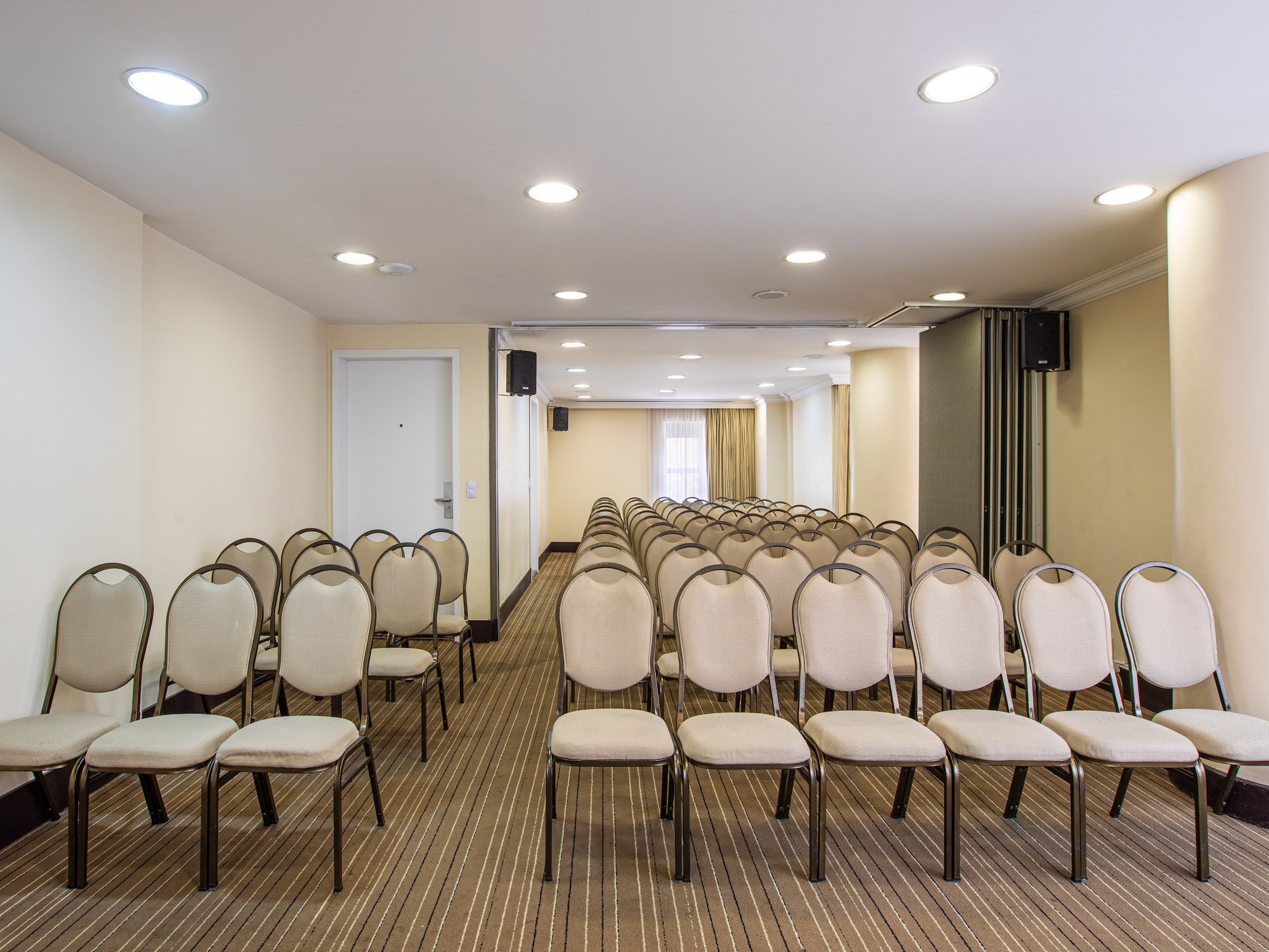 a room with rows of chairs