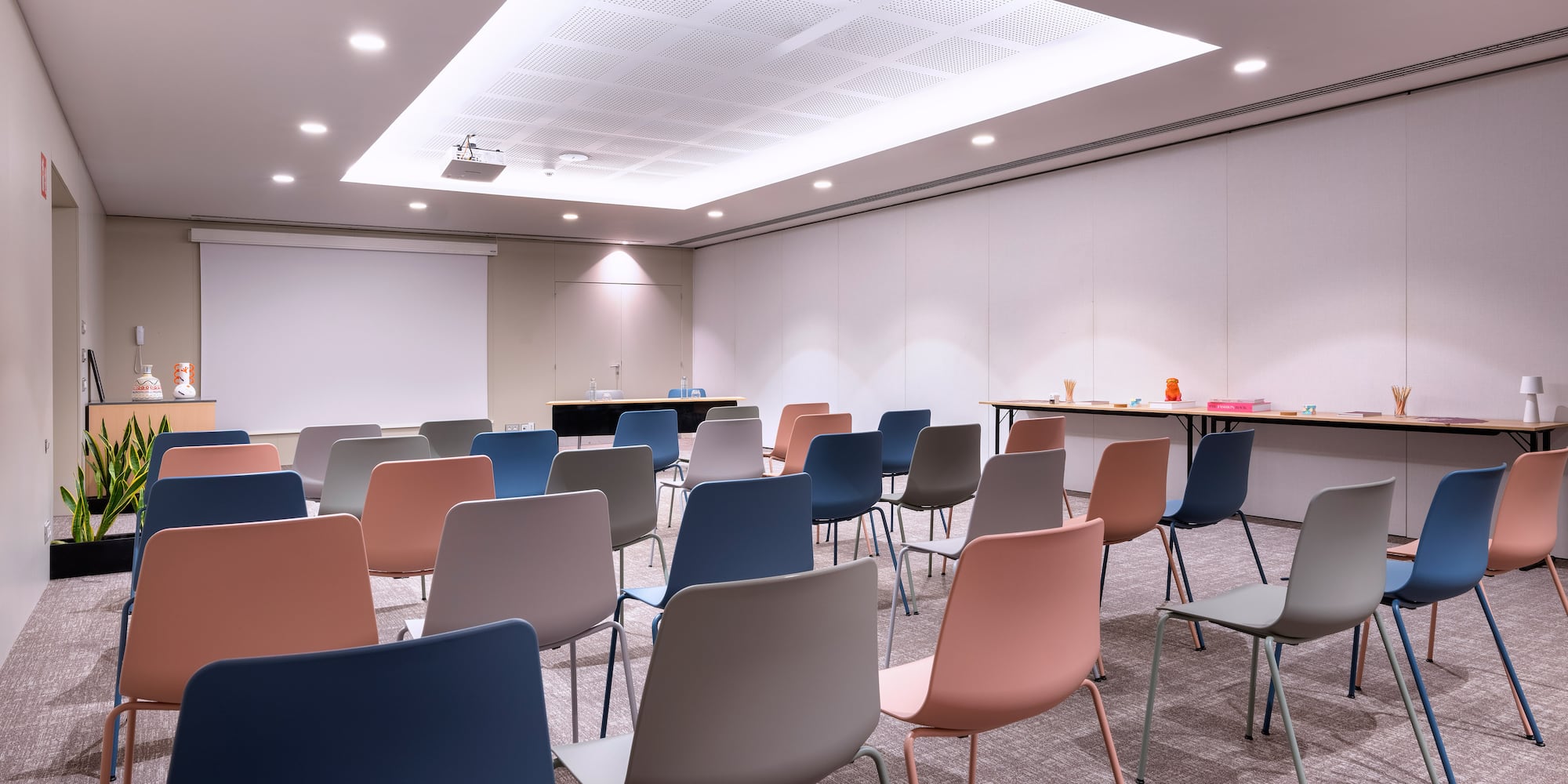 a room with many chairs and a table