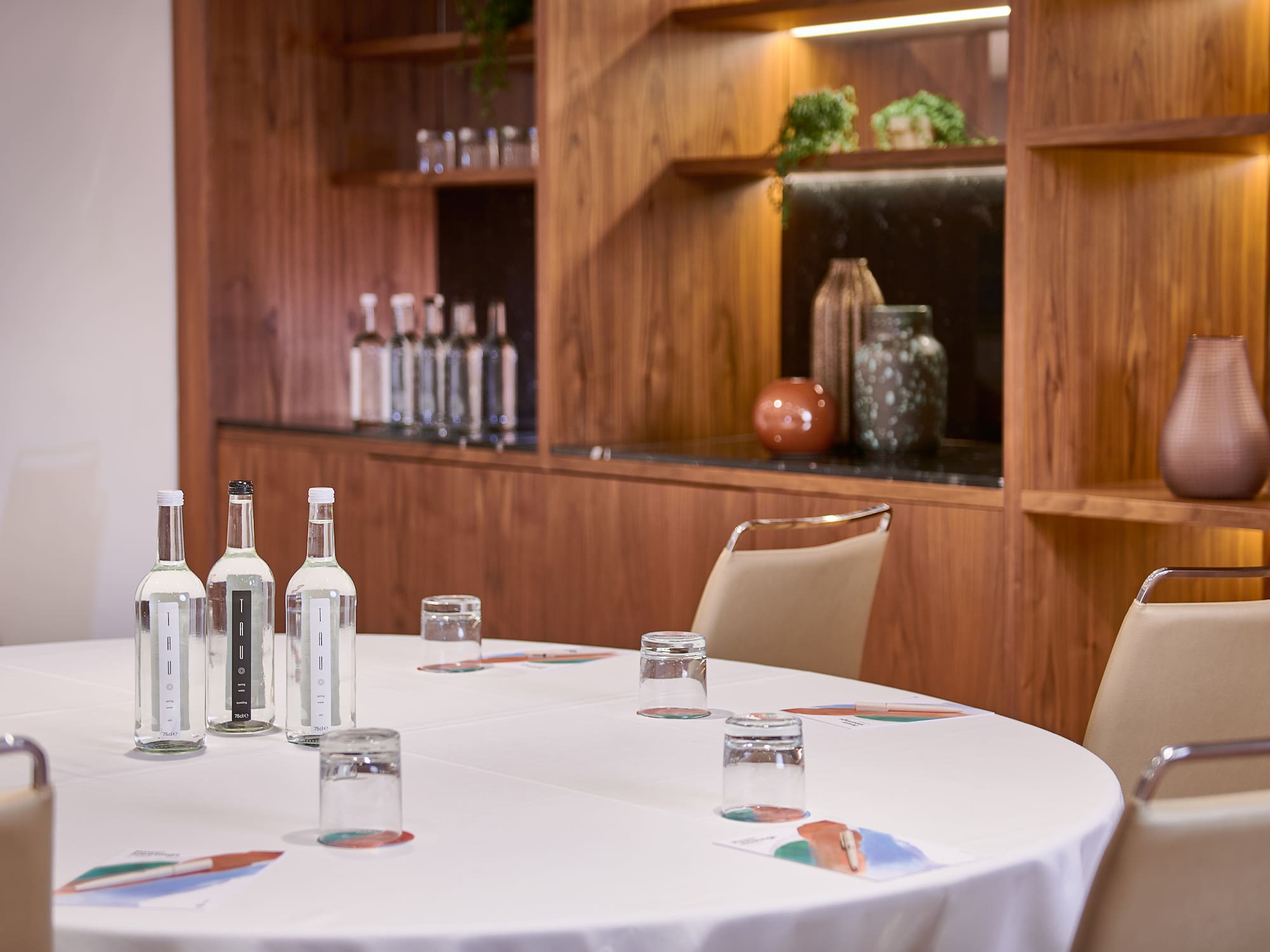 a table with white tablecloth and bottles on it