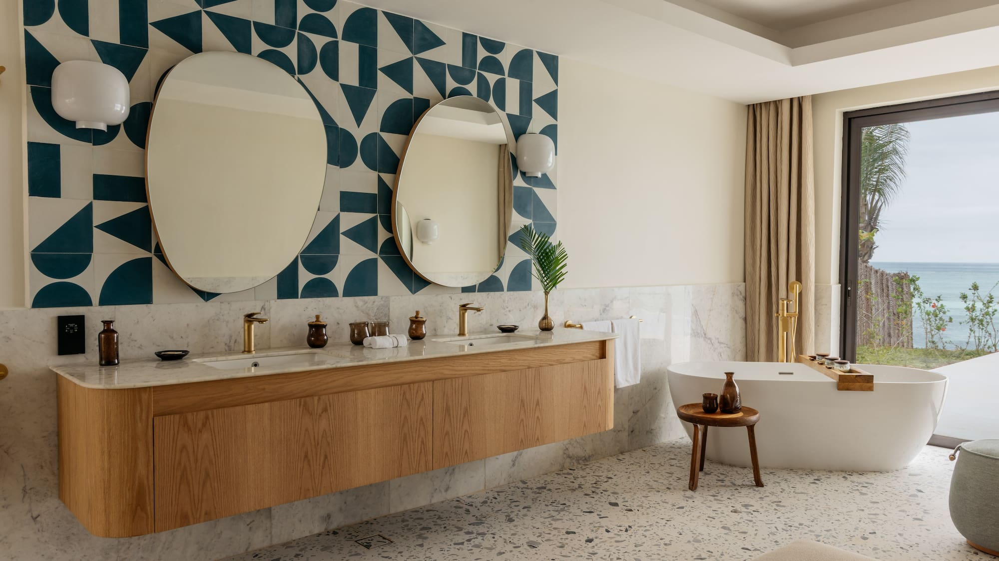 a bathroom with a bathtub and mirrors