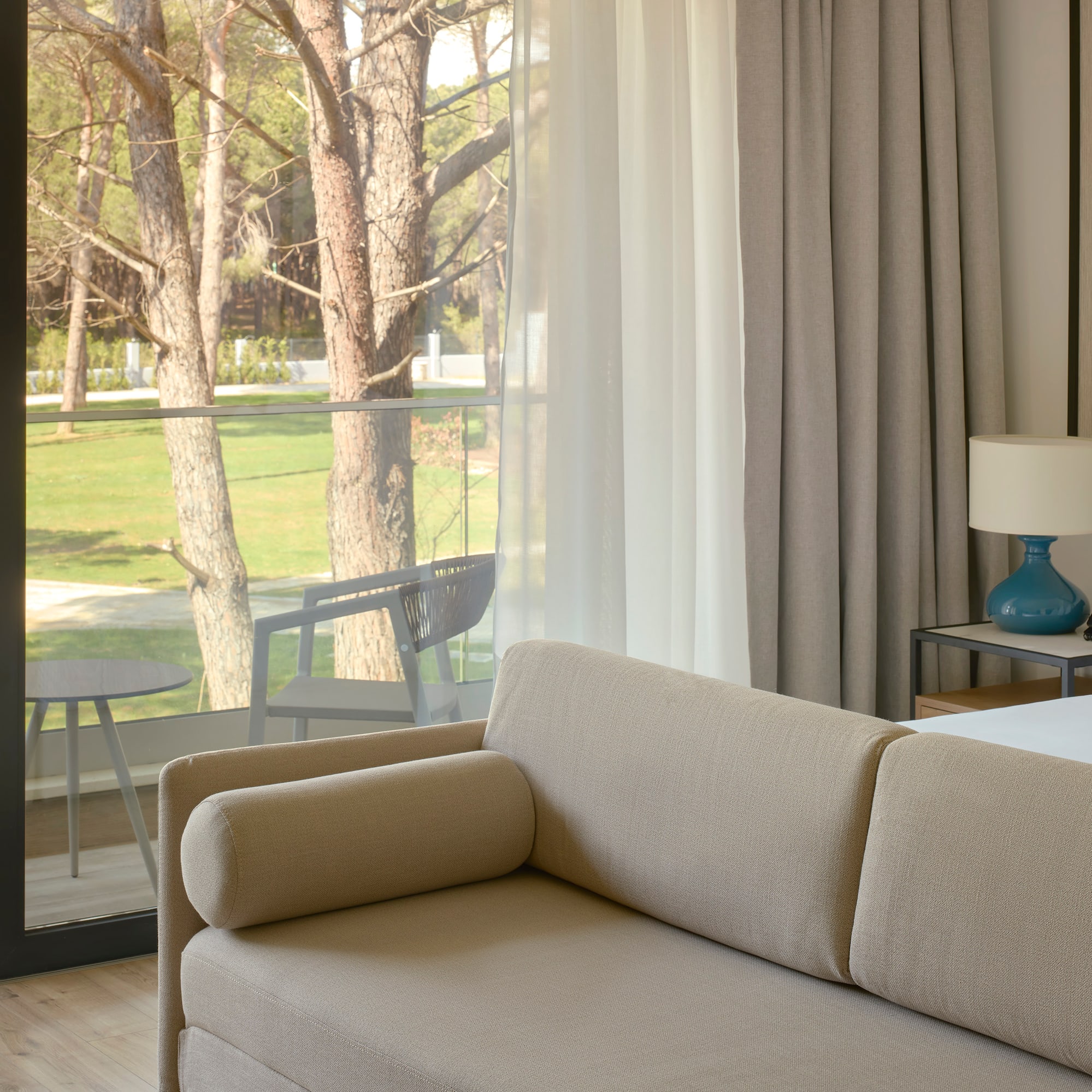 a couch in a room with a glass door