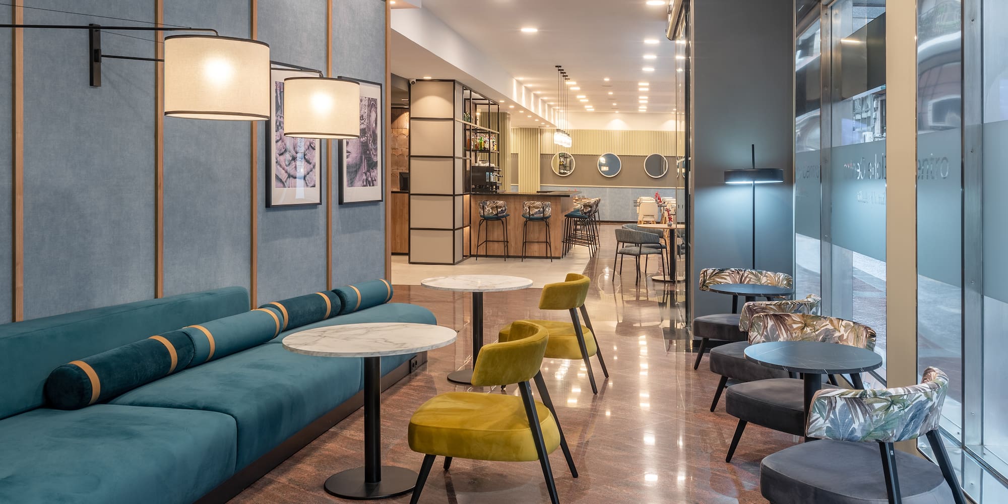 a room with a couch and tables