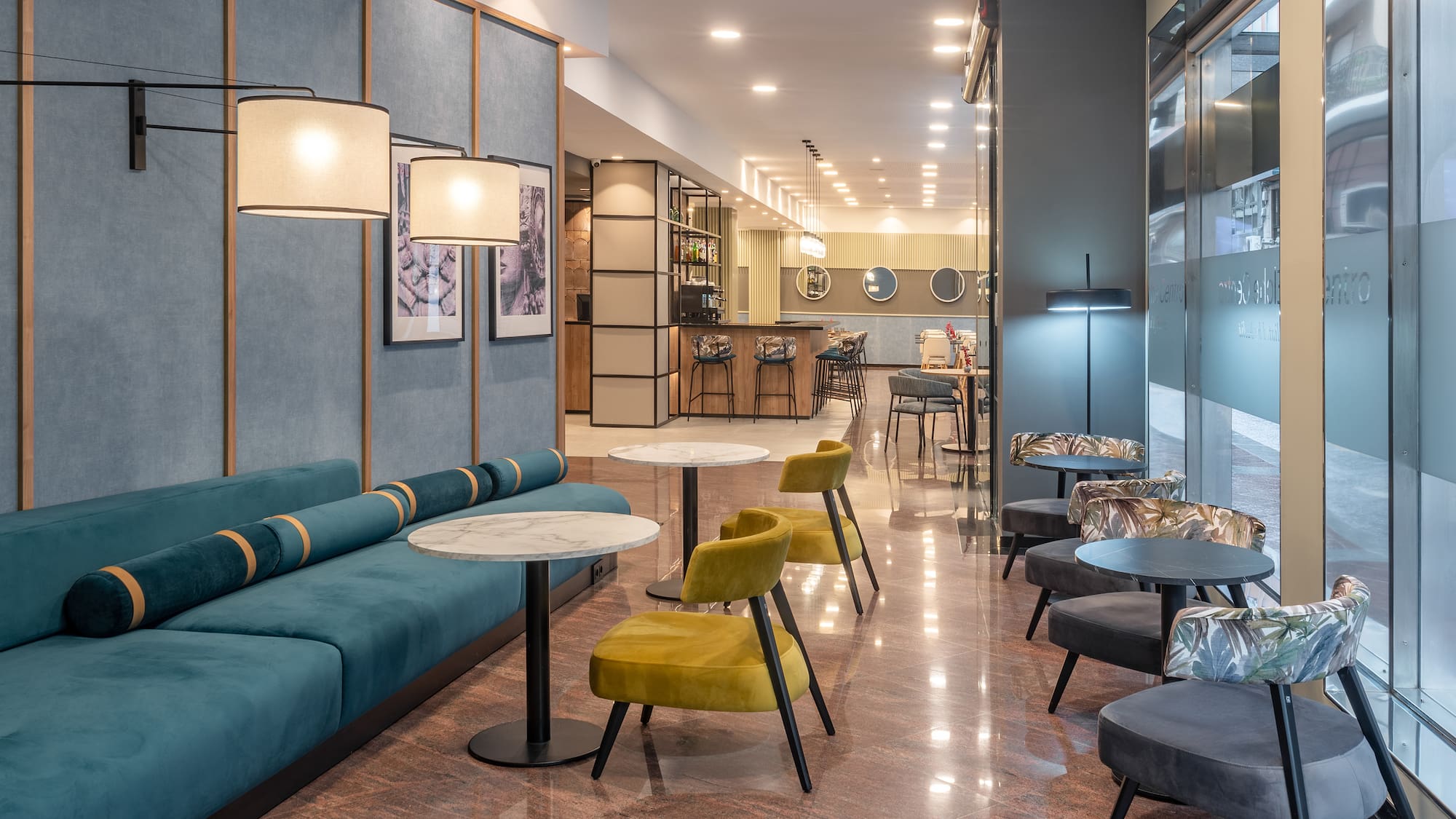 a room with a couch and tables