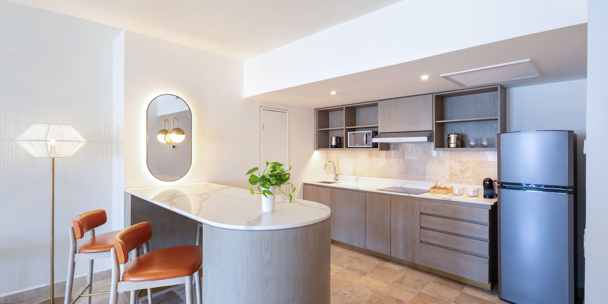 a kitchen with a countertop and chairs