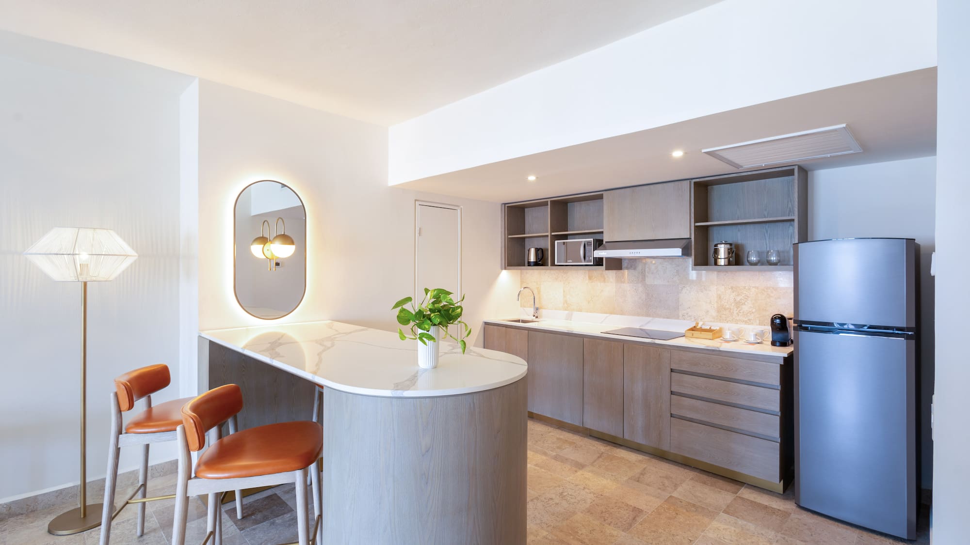 a kitchen with a countertop and chairs