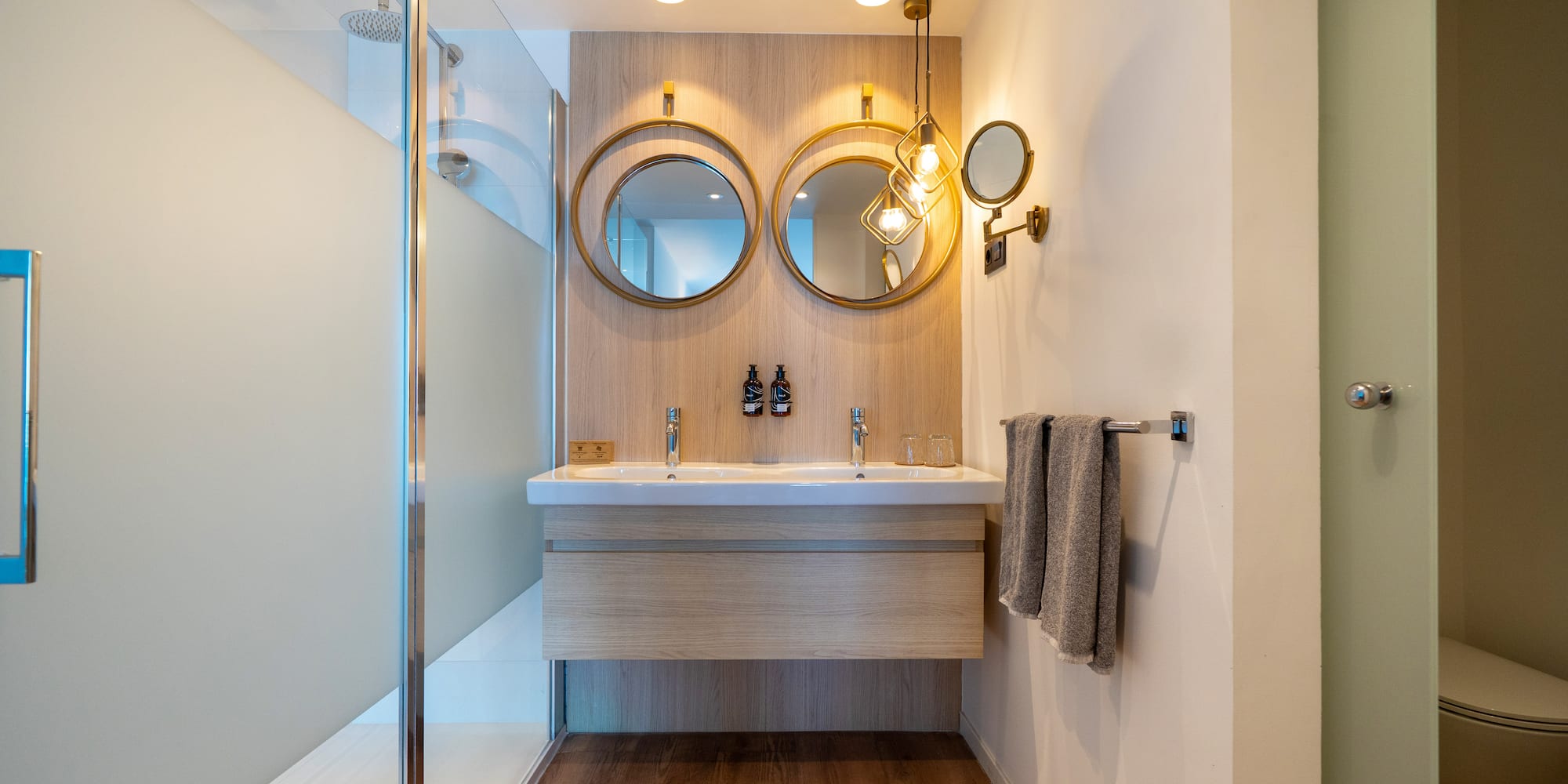 a bathroom with a shower and a sink