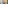 Modern hotel bathroom with double vanity, gold mirrors, and walk-in shower.