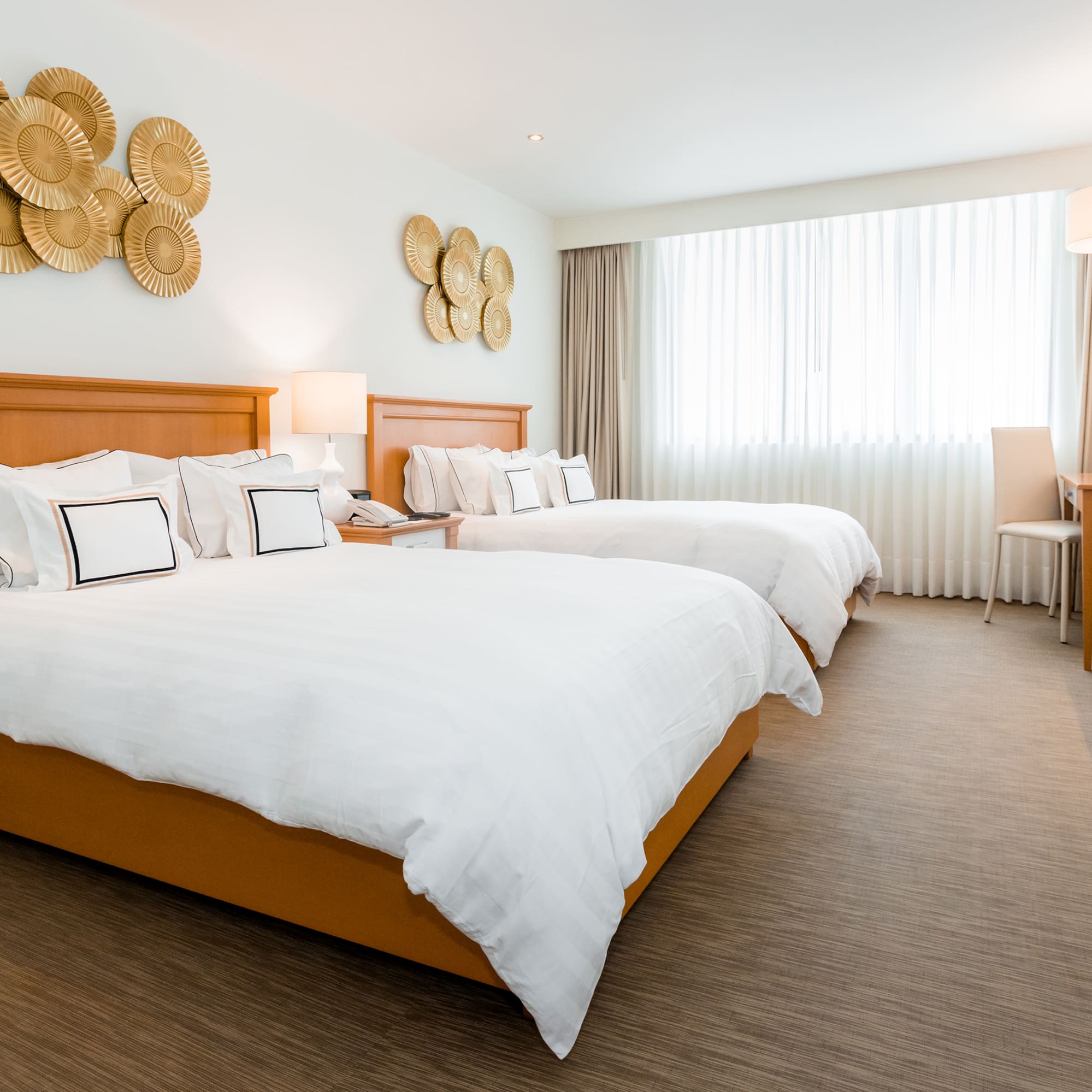 a hotel room with two beds