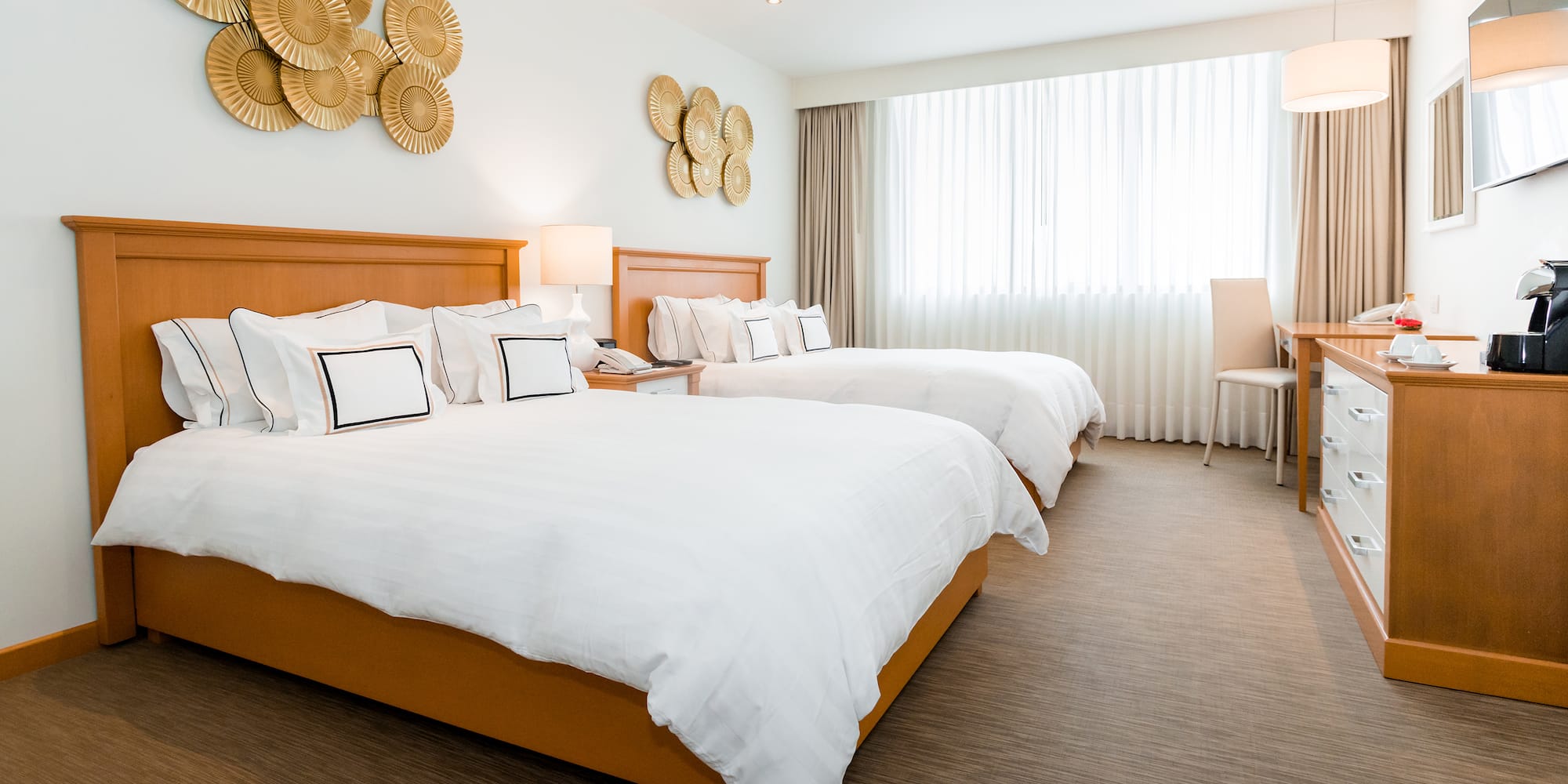 a hotel room with two beds