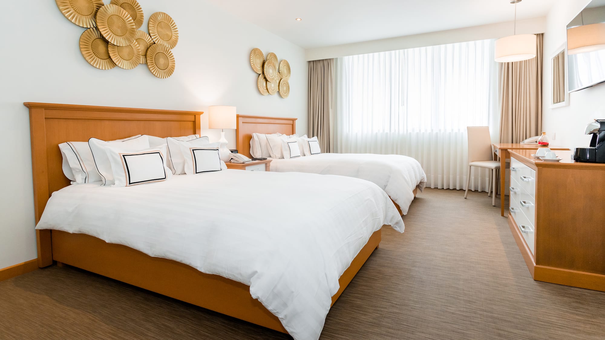 a hotel room with two beds