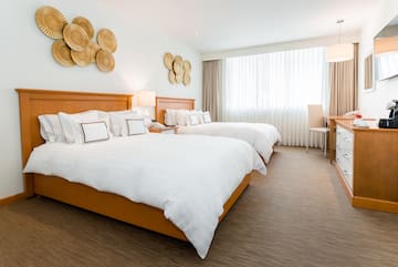 a hotel room with two beds