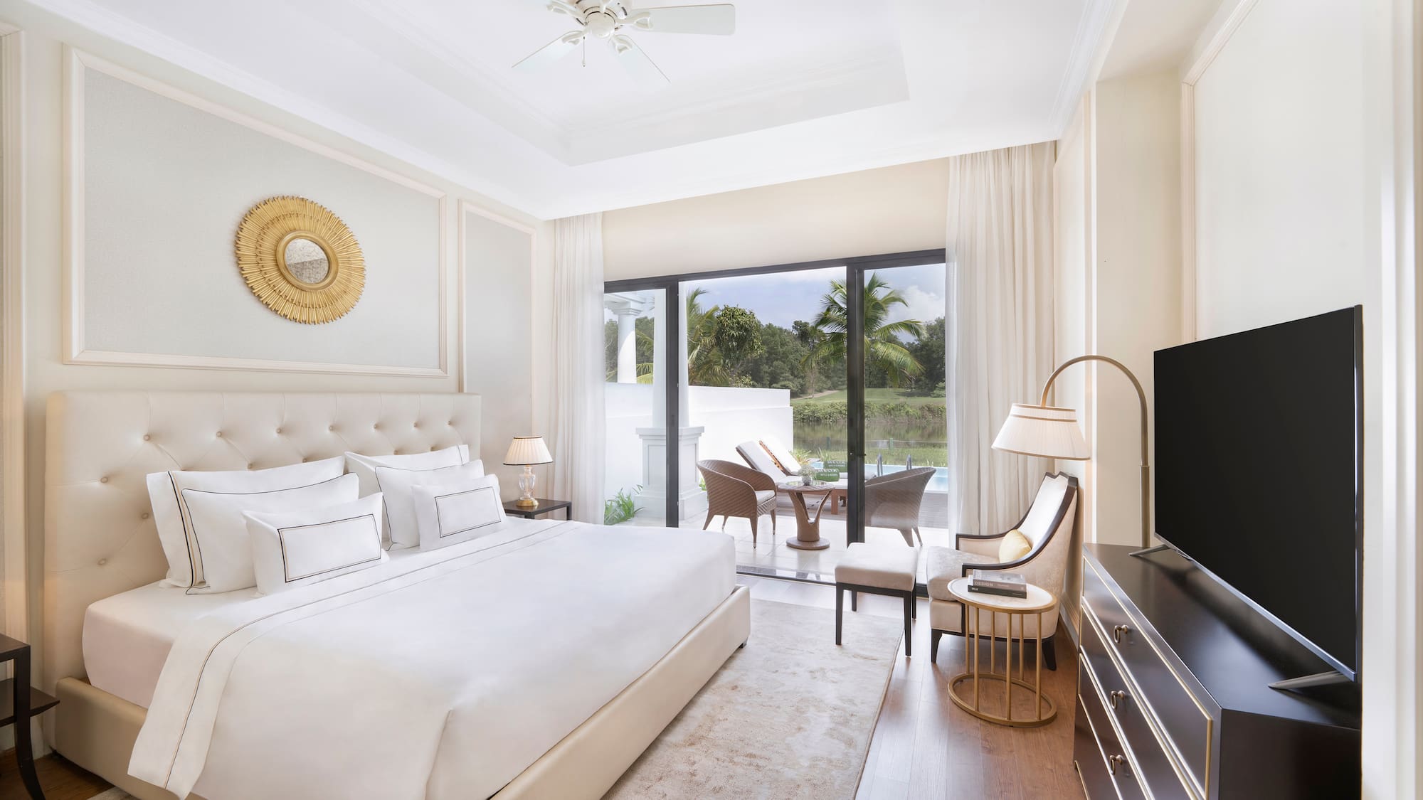 a bedroom with a television and a large bed