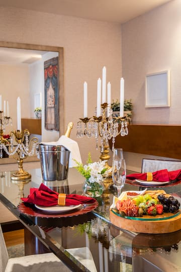 a table with a candelabra and candlesticks