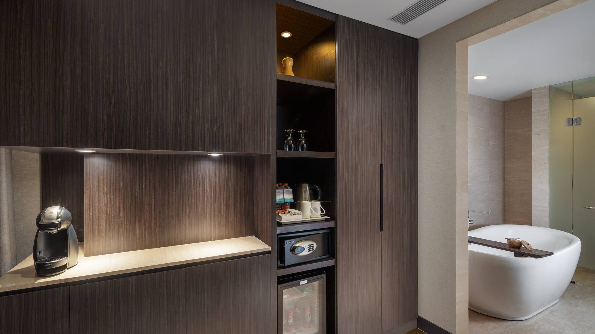 a room with a tub and a cabinet