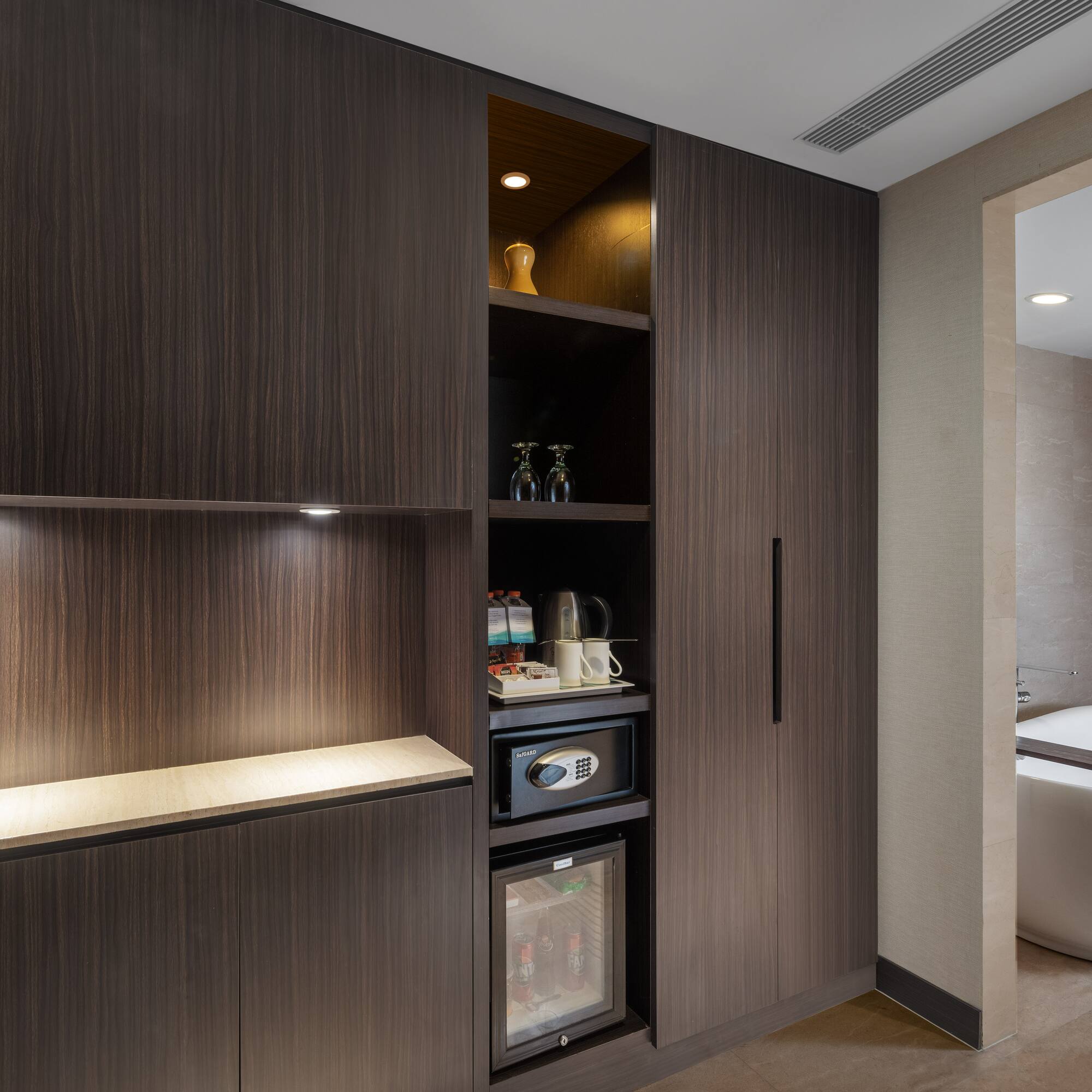 a room with a tub and a cabinet