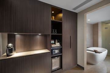 a room with a tub and a cabinet