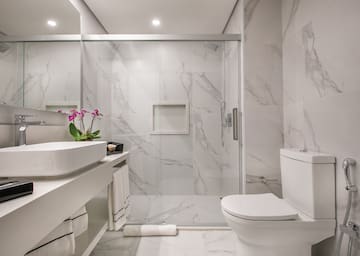 a bathroom with a glass shower door
