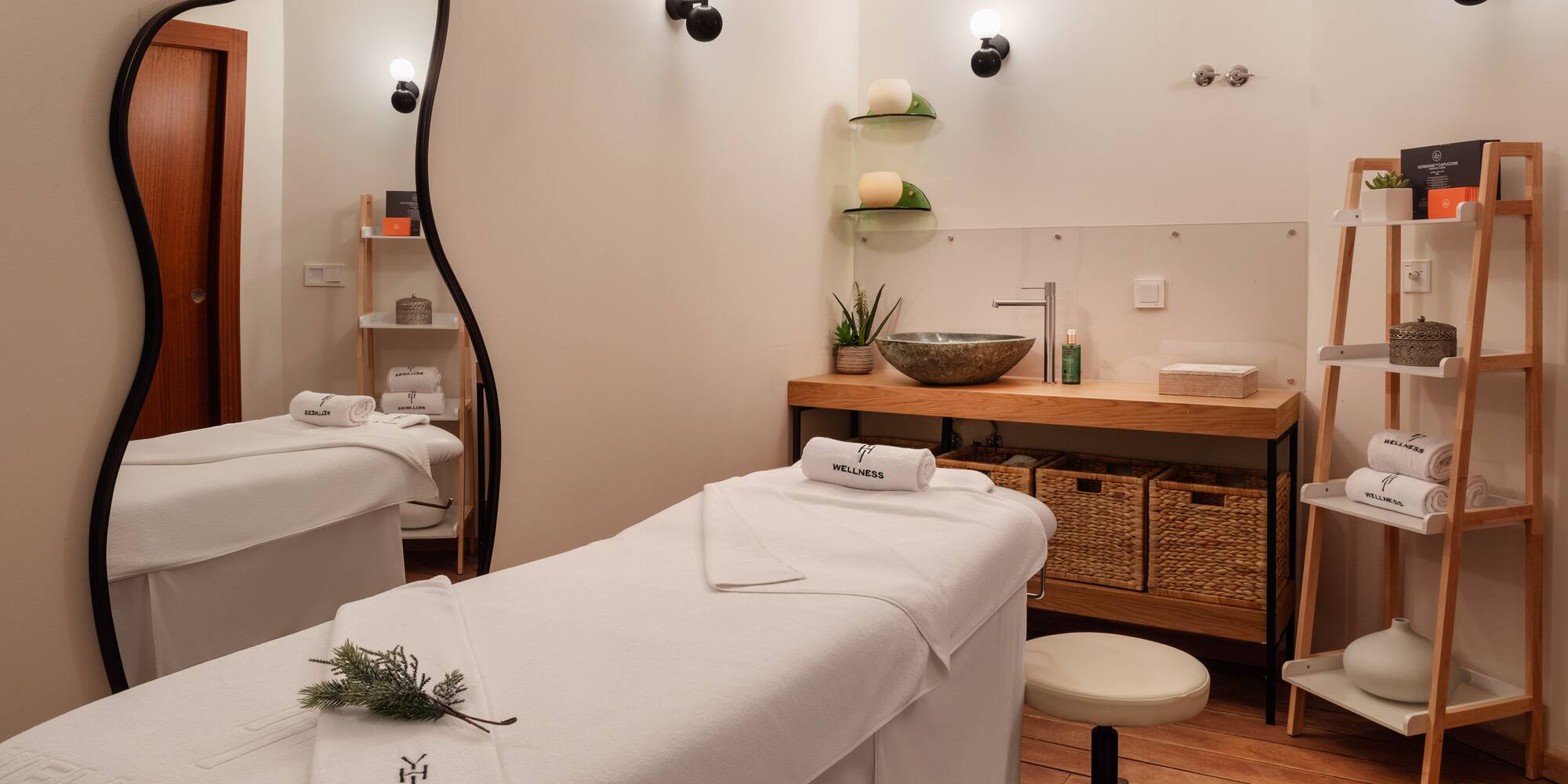 a massage room with white towels