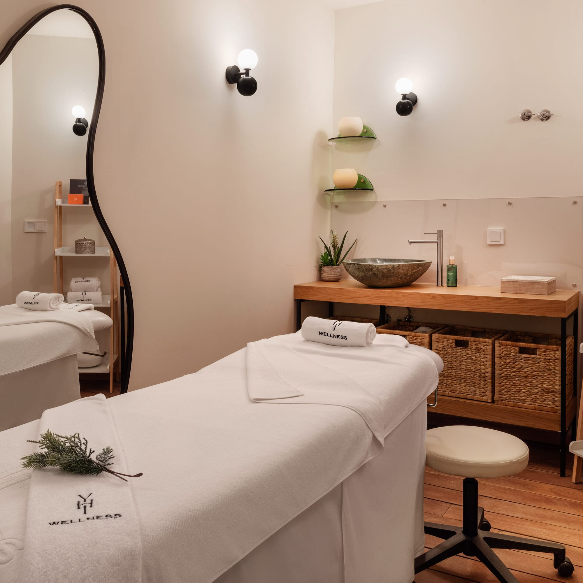 a massage room with white towels