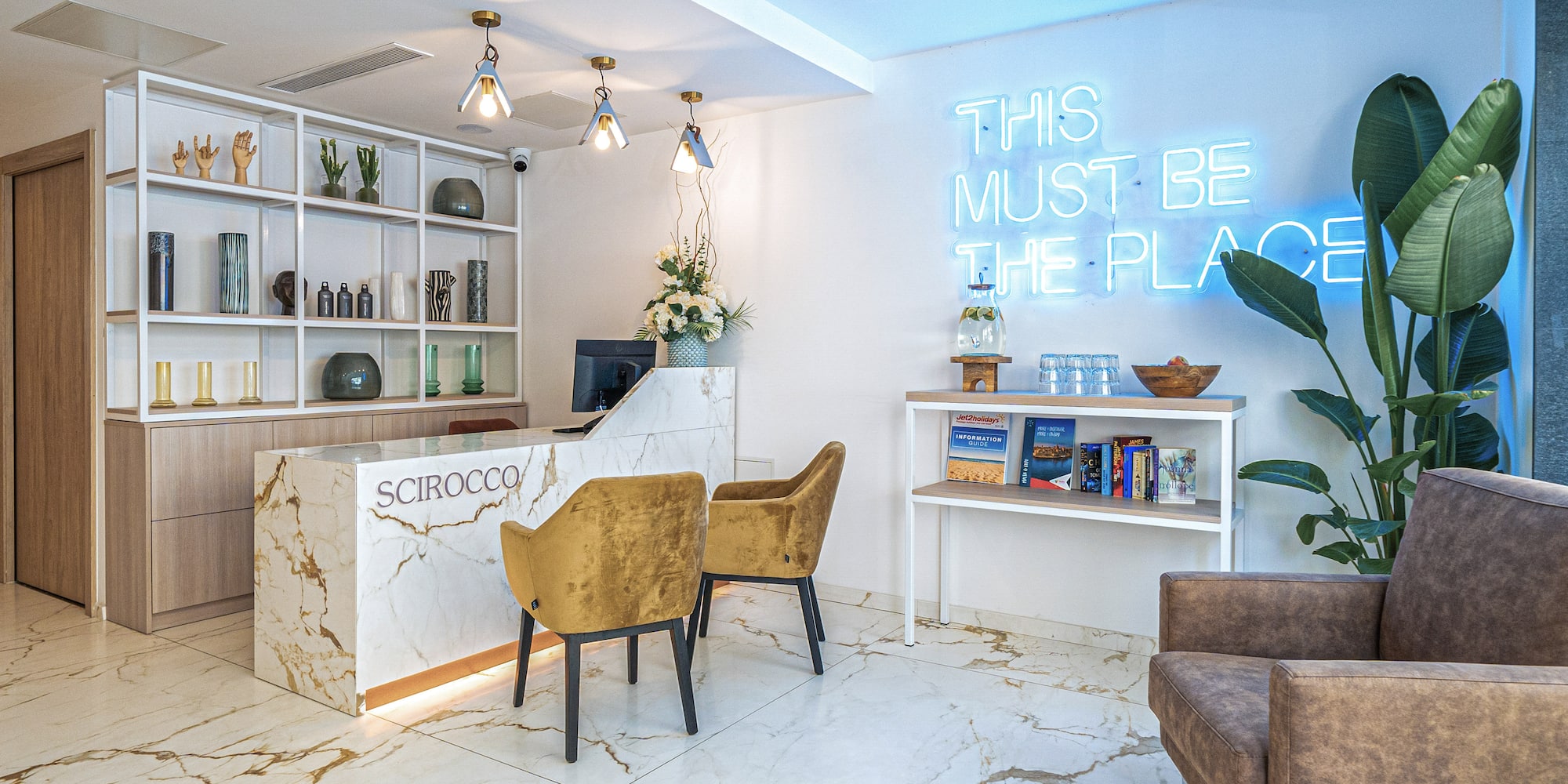 a reception desk and chairs in a room