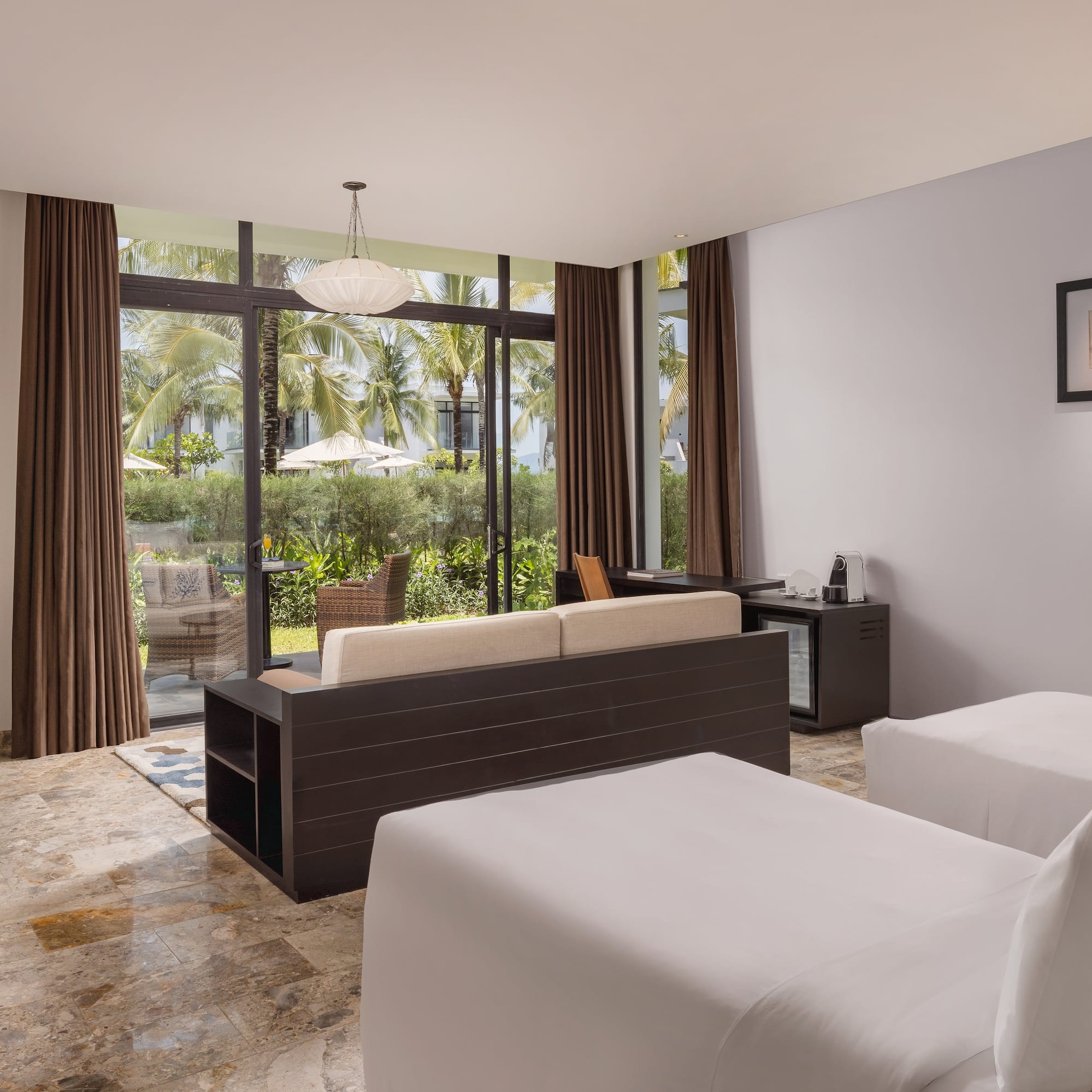 a room with two beds and a couch