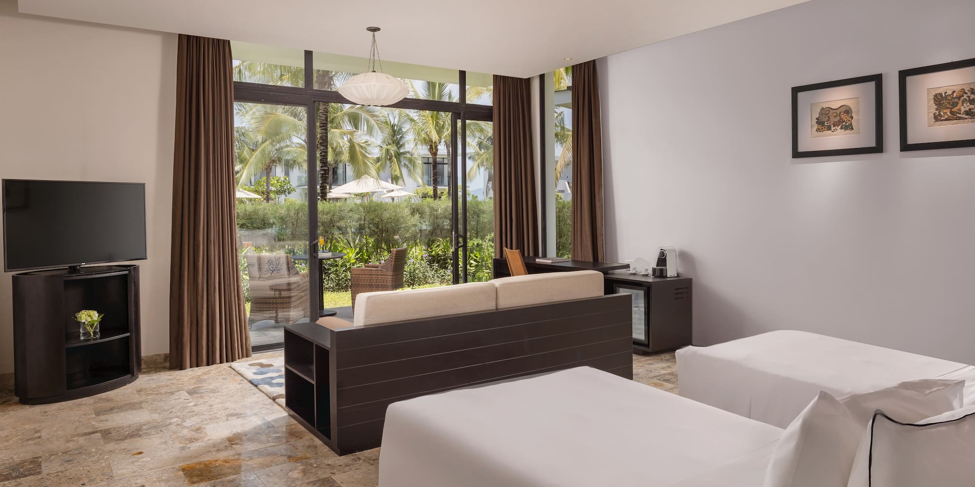 a room with two beds and a couch