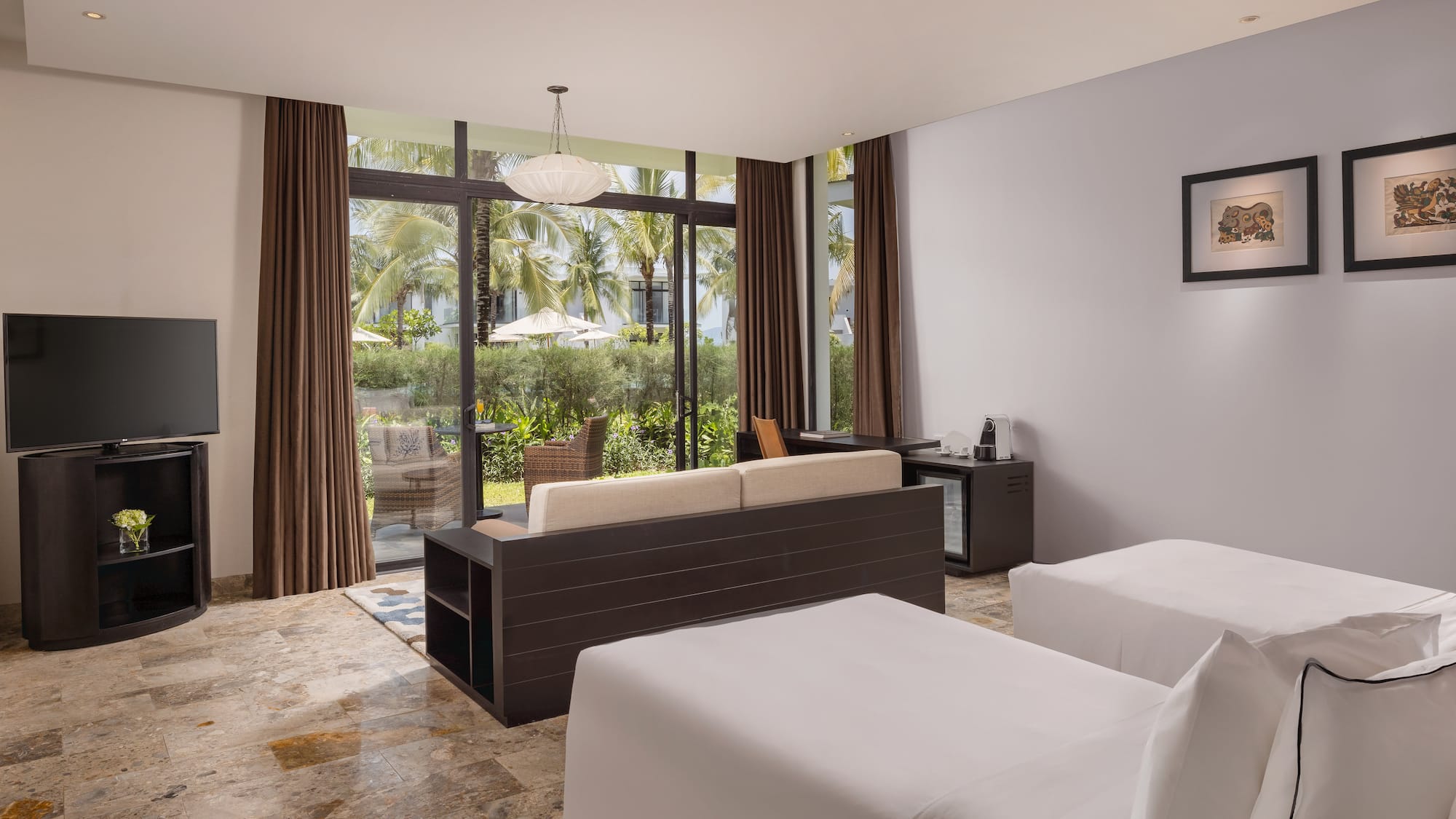 a room with two beds and a couch