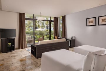 a room with two beds and a couch