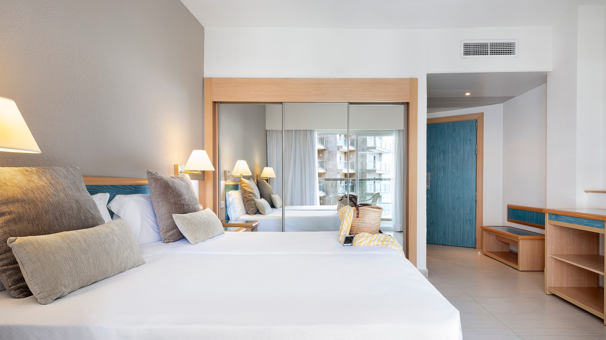 a room with a bed and a mirror