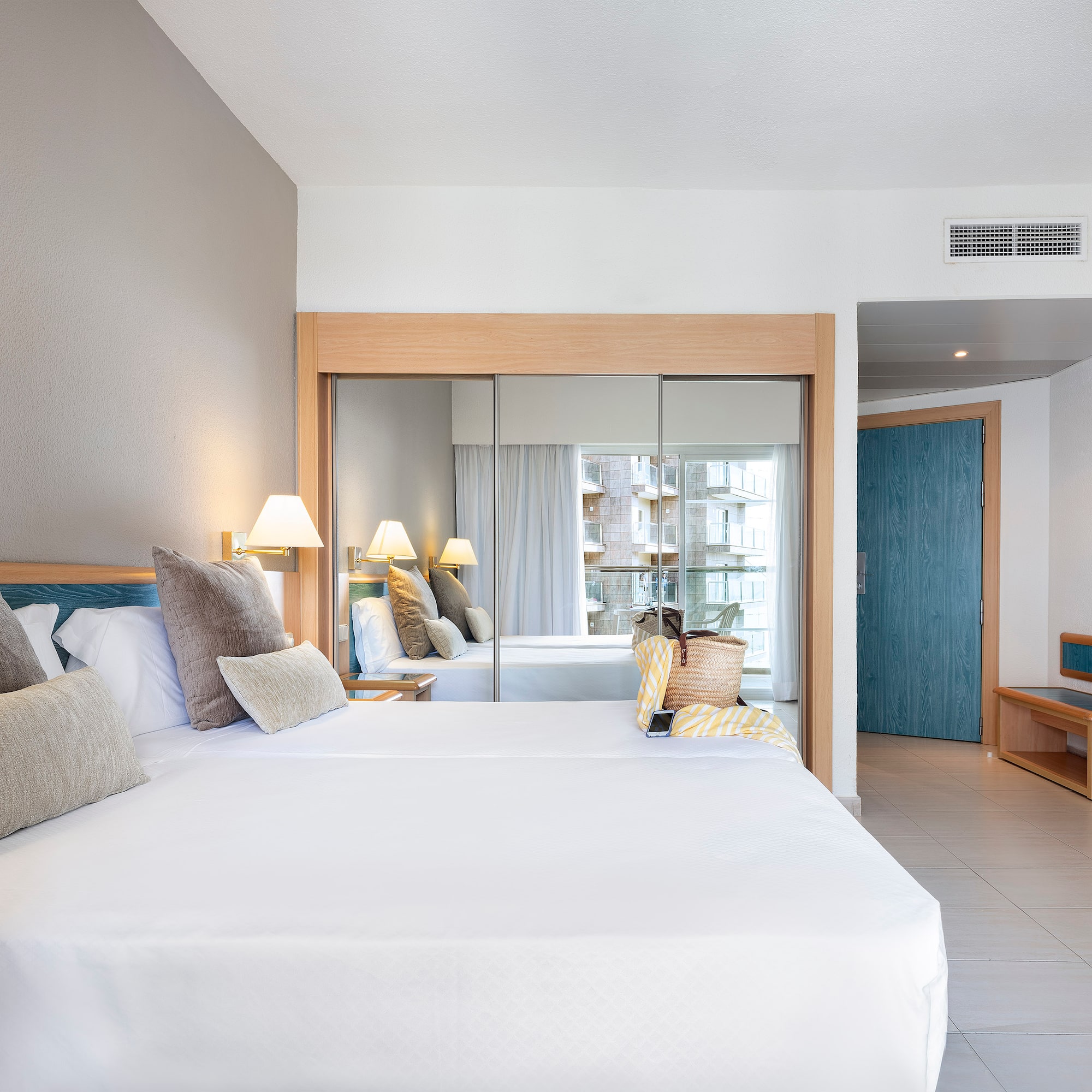 a room with a bed and a mirror