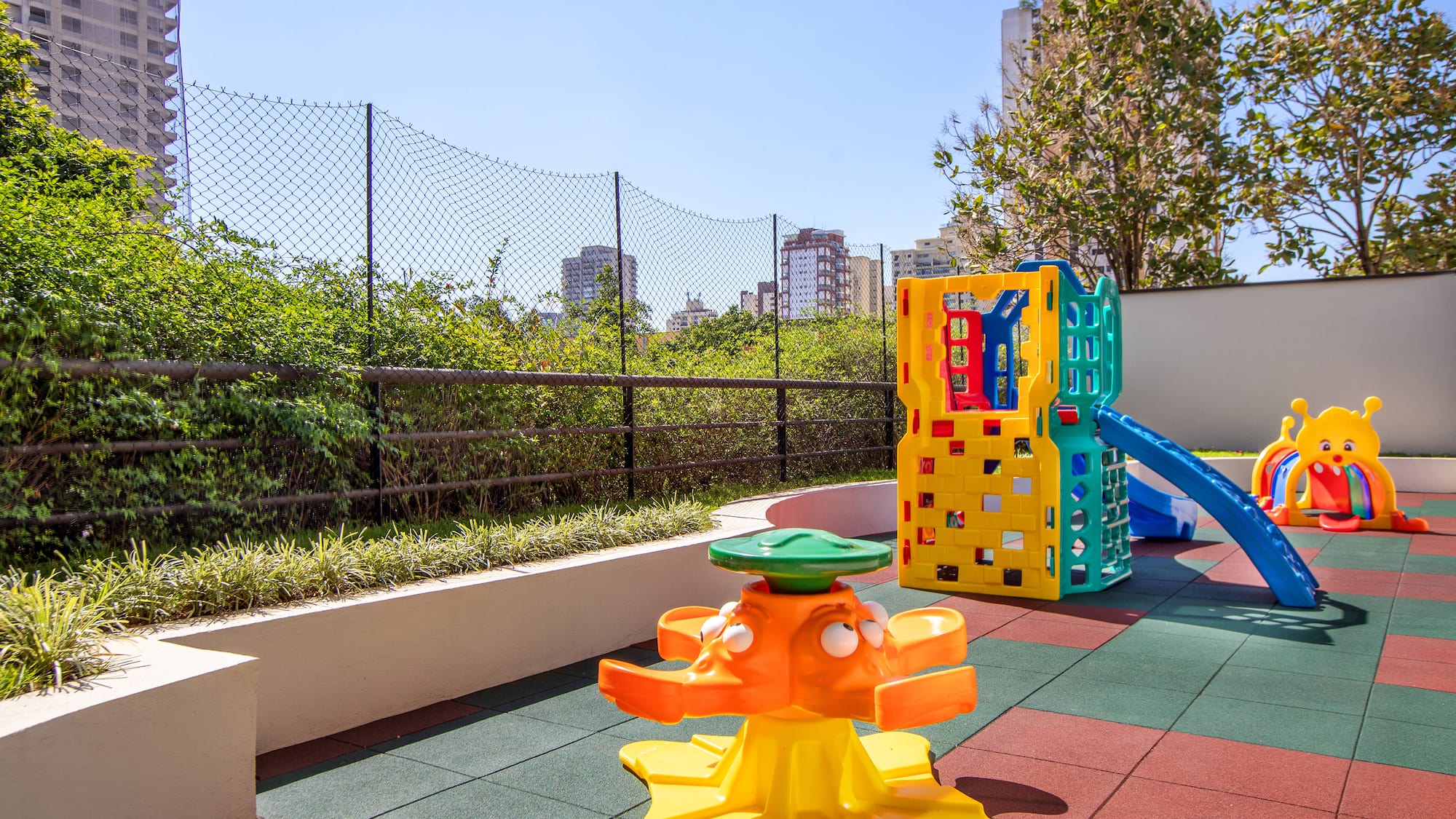 a playground with a slide and a play set