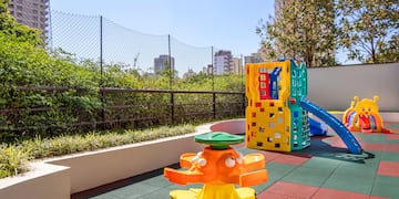 a playground with a slide and a play set