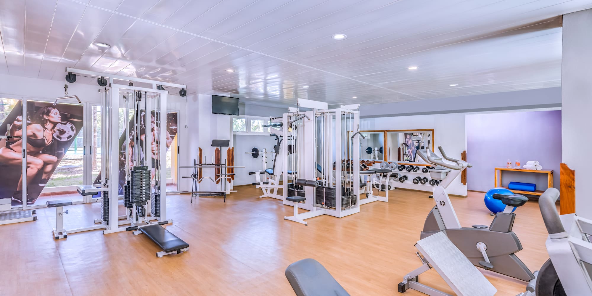 a large room with exercise equipment