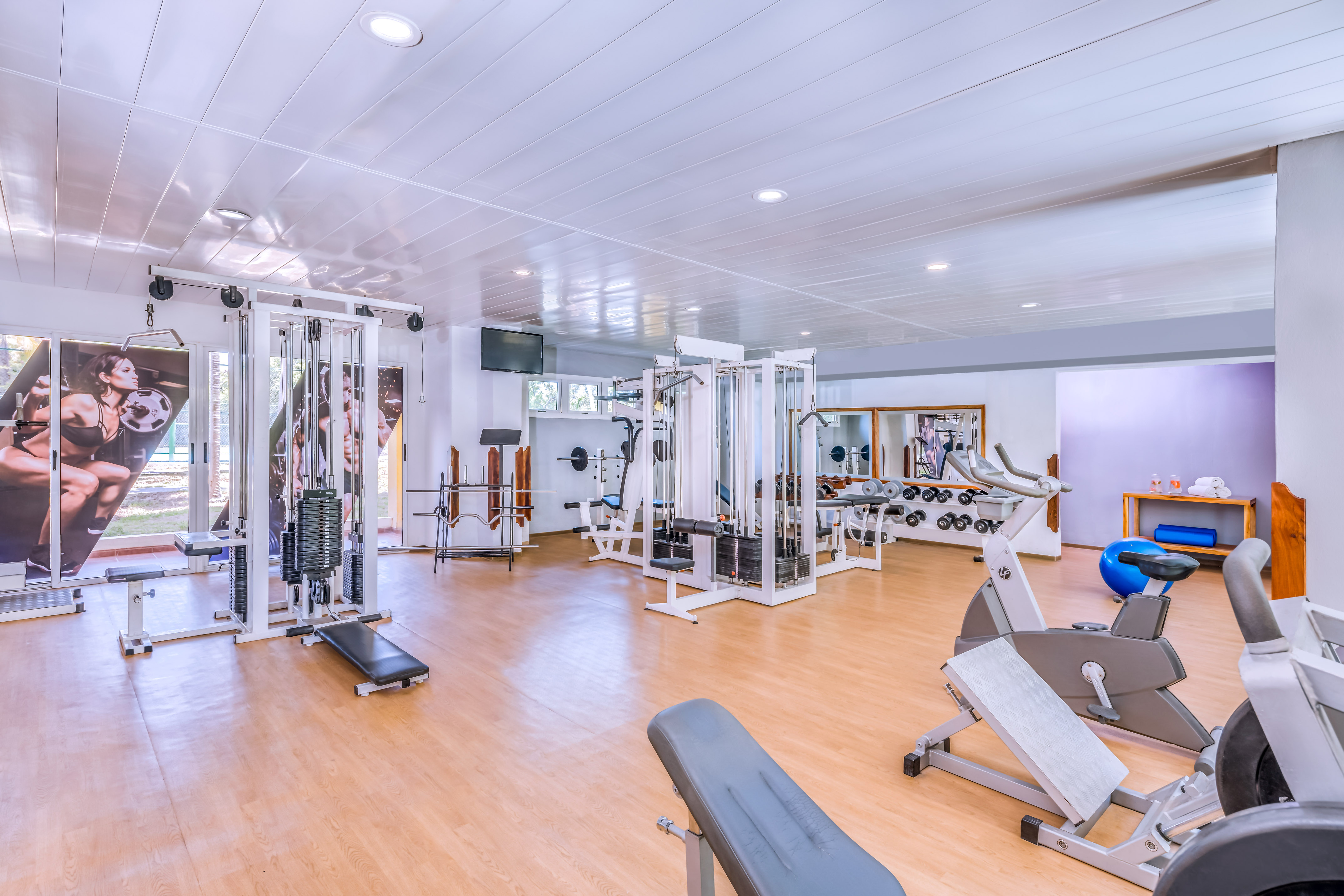 a large room with exercise equipment