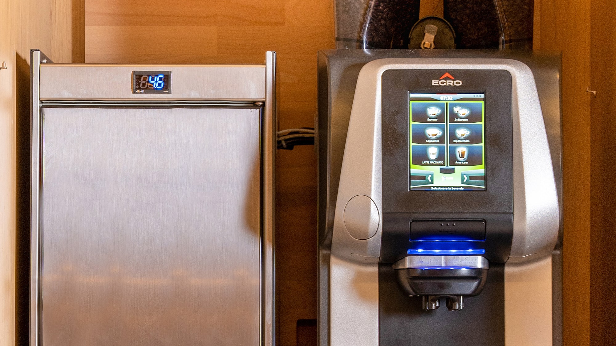a machine next to a refrigerator