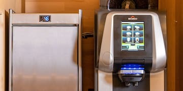 a machine next to a refrigerator