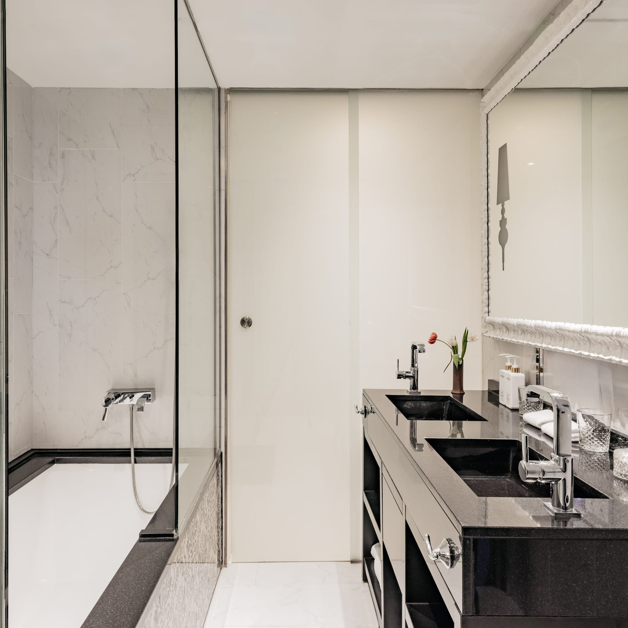 a bathroom with a shower and sink