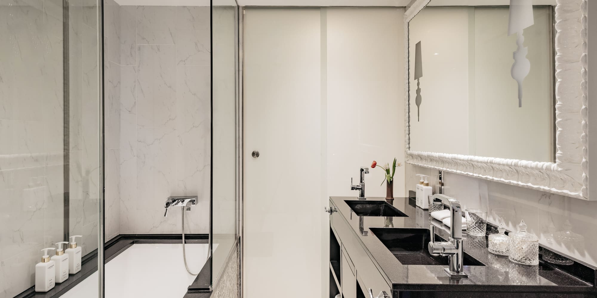 a bathroom with a shower and sink