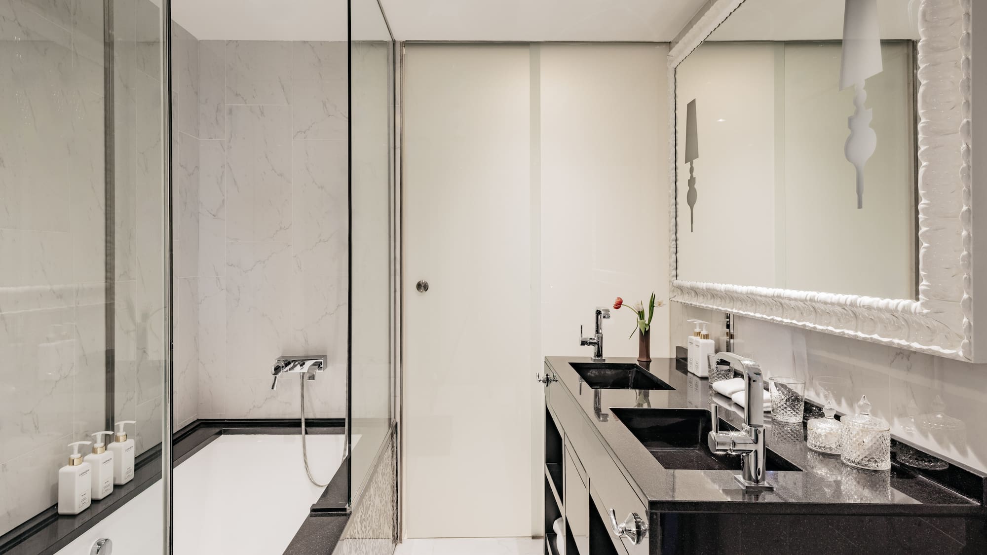 a bathroom with a shower and sink