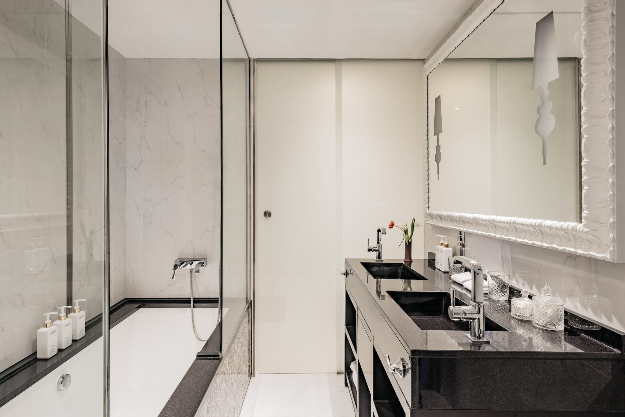 a bathroom with a shower and sink