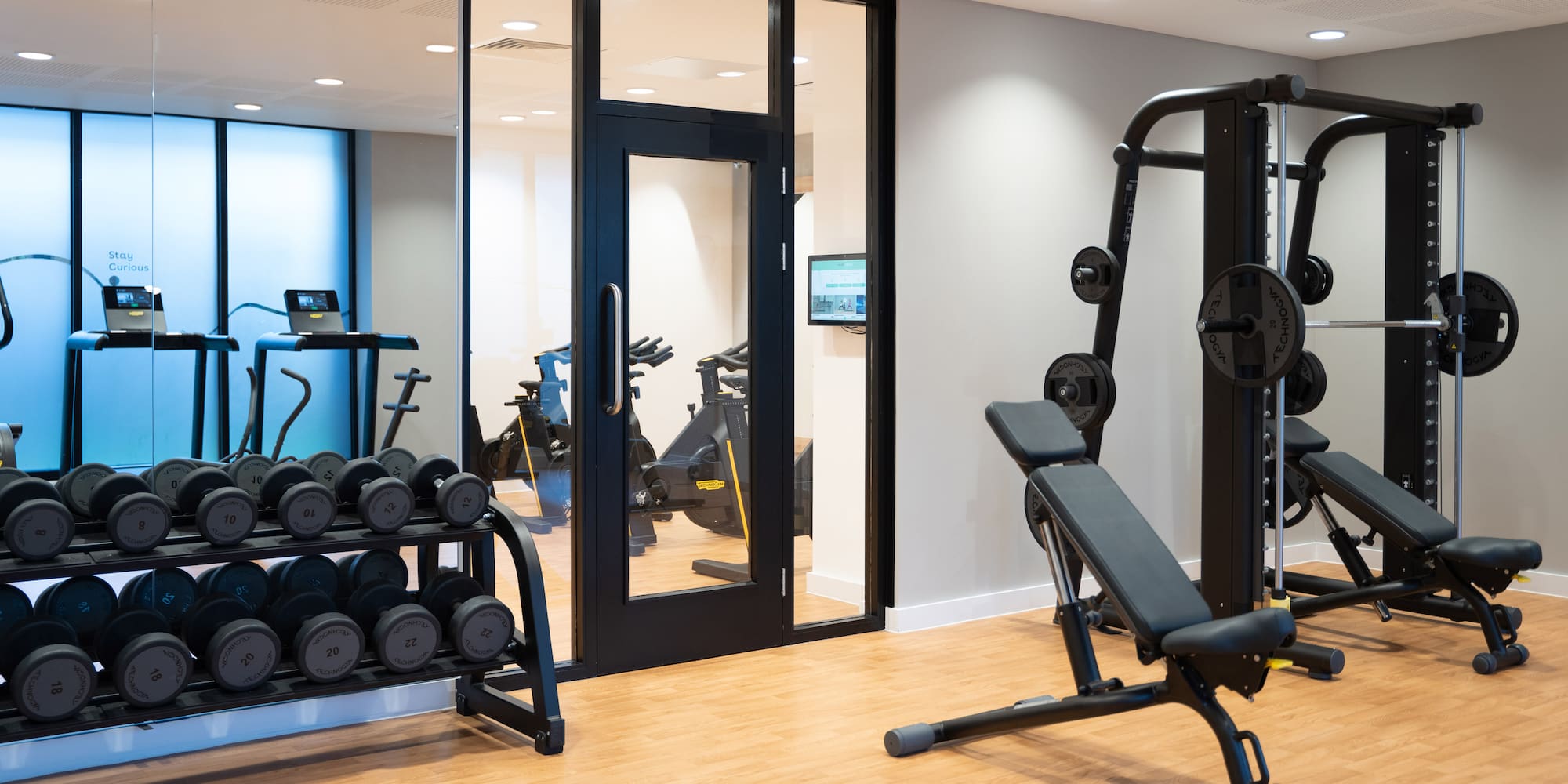 a gym with weights and exercise equipment