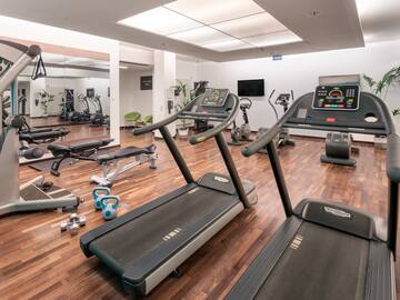a room with treadmills and exercise equipment