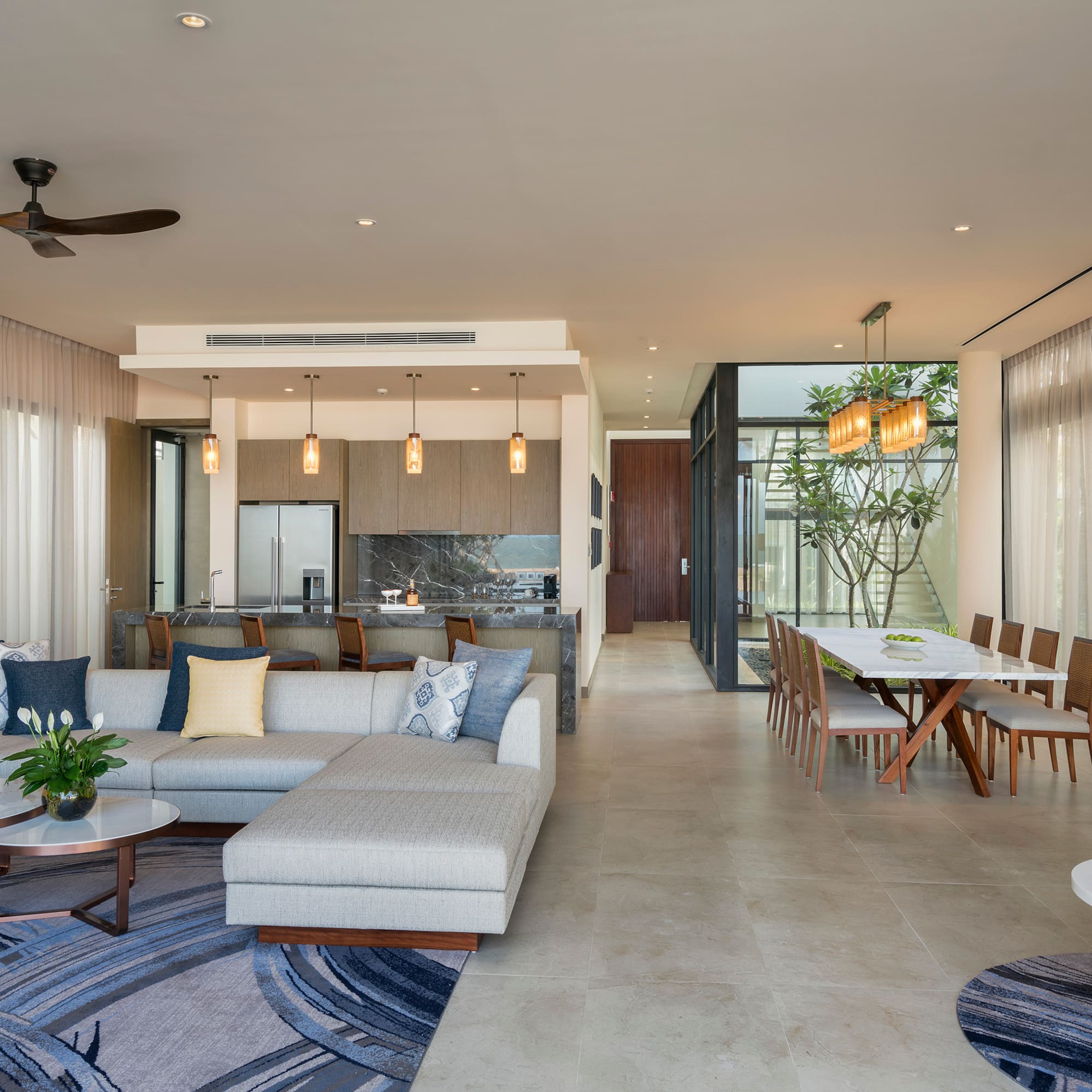 a living room with a couch and dining table
