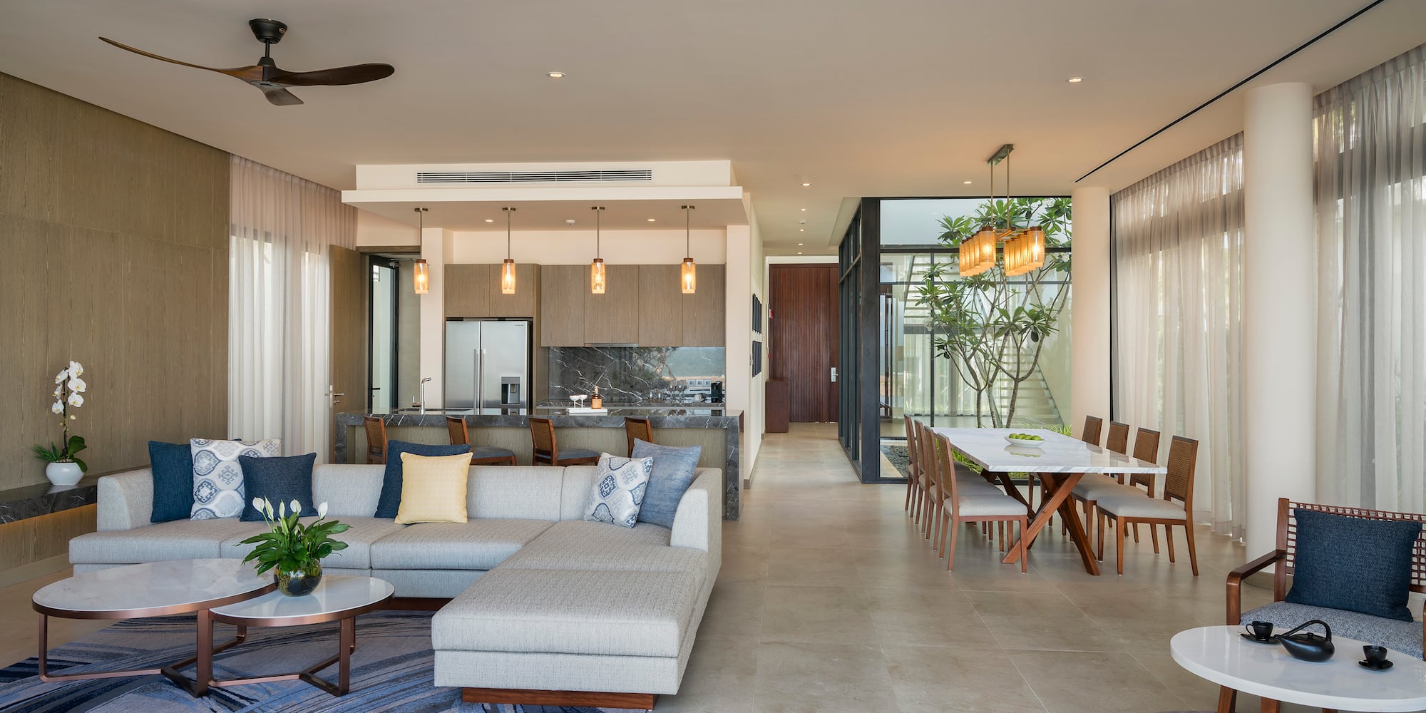 a living room with a couch and dining table